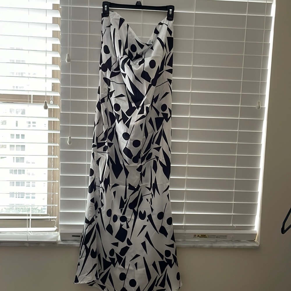 Geometric black and white satin maxi dress. This is a slim fit dress